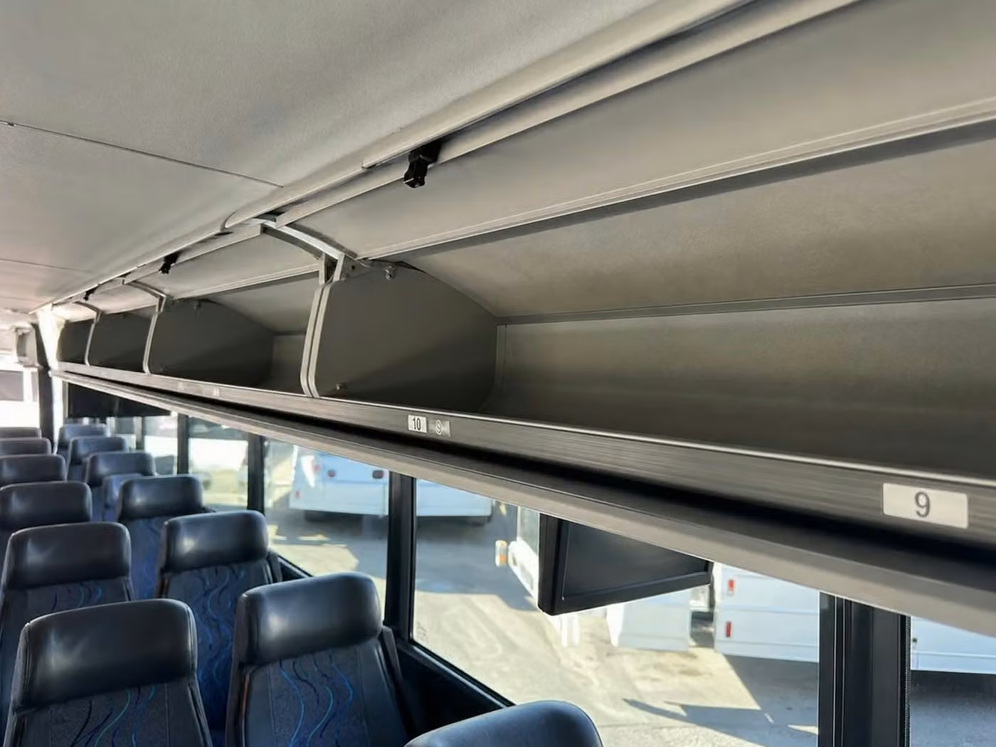 lathrop charter bus overhead storage